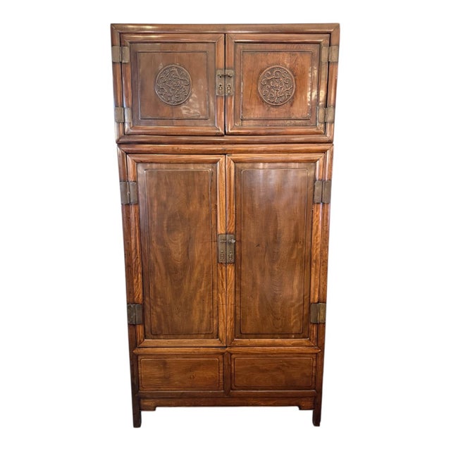 Design Plus Gallery presents a Chinese Compound Cabinet from the Early 20th Century. The cabinet has two pieces that...