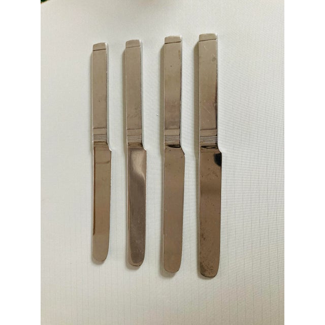 Midcentury stainless set of 4 dinner knives 9.05"L , makers mark reads " Stanley Roberts Korea" in Oblique Pattern , they...