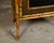 An English small bamboo cabinet from circa 1880 with painted panels, single mirror, drawer and door. Born in England circa...