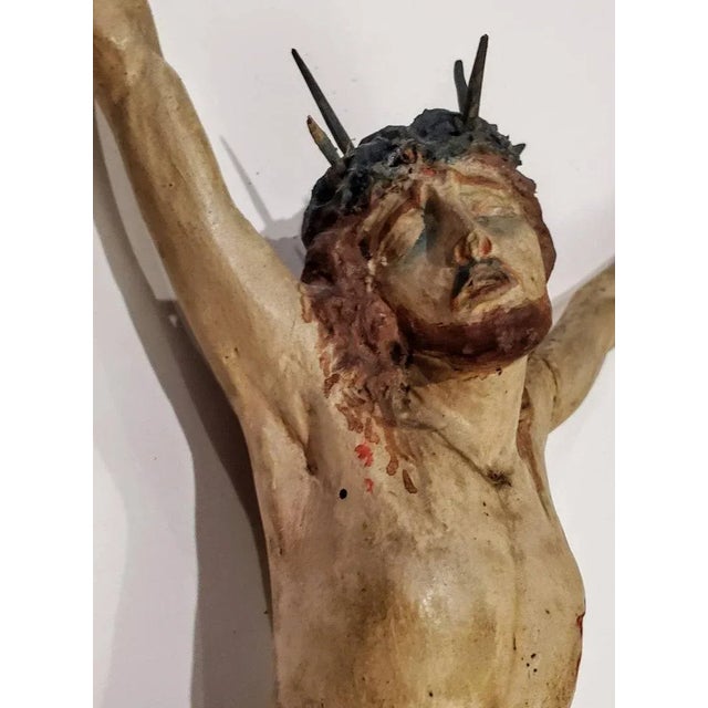 A scarce Baroque period hand carved and sculpted Spanish church altarpiece. The figural sculpture mounted on later antique...