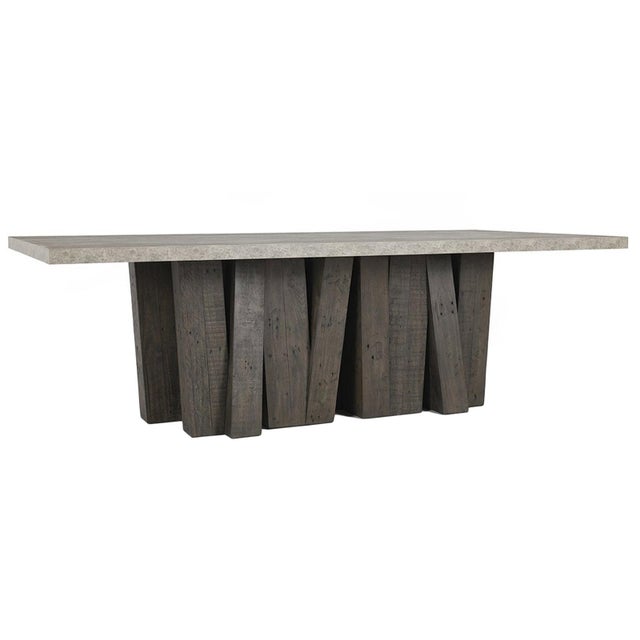 Modern large dining table with grey pine wood posts as the base and a concrete laminate top. Brutalist inspired design...