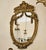 Bring regal elegance to your interior with this exquisite French Baroque-inspired oval wall mirror. Its beautifully...