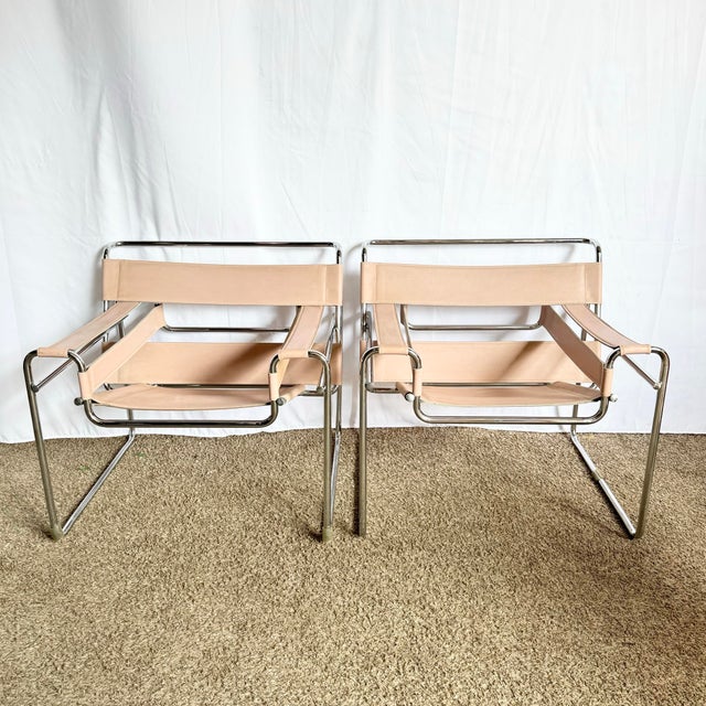 A chic reinterpretation of the iconic Wassily chair, this pair of mid-century modern lounge chairs blends Bauhaus-inspired...