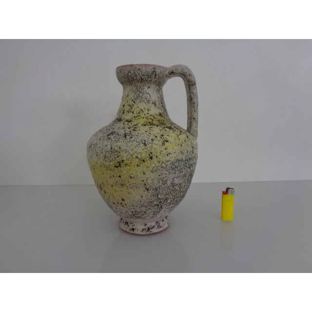 Ceramic Henkel vase by Fridegart Glatzle for Karlsruhe Majolica from the 1960s. Inscribed on the underside. This piece has...