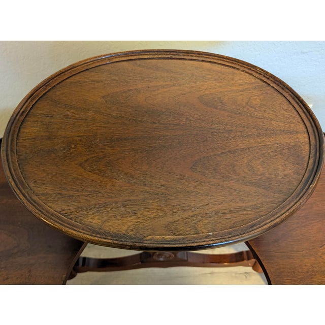 This is an Antique Mahogany Mersman 3 Tier Stand or Tea Table with Claw Feet 1930s Era An antique mahogany three tier...