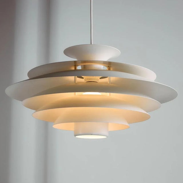 ‘Type 52580’ aluminium pendant with seven lamellas from the 1990s produced by Form-Light. Ideal for dining tables or...