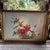A beautifully composed mid-century Chinese silk painting featuring a graceful long-tailed bird perched among lush peonies...