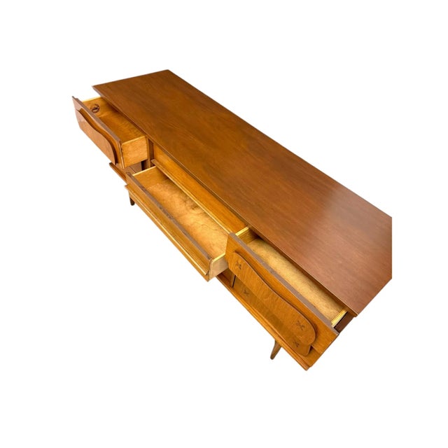 This rare Bassett Furniture dresser and Tallboy from the iconic “Monterey” line, designed by Leo Jiranek, was produced for...