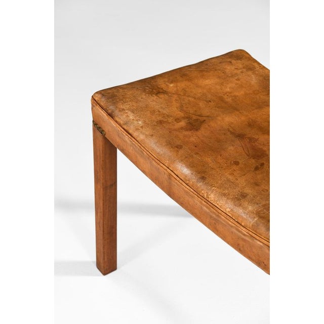 This very rare stool, designed by frits henningsen and produced by his own cabinetmaking workshop in denmark during the...