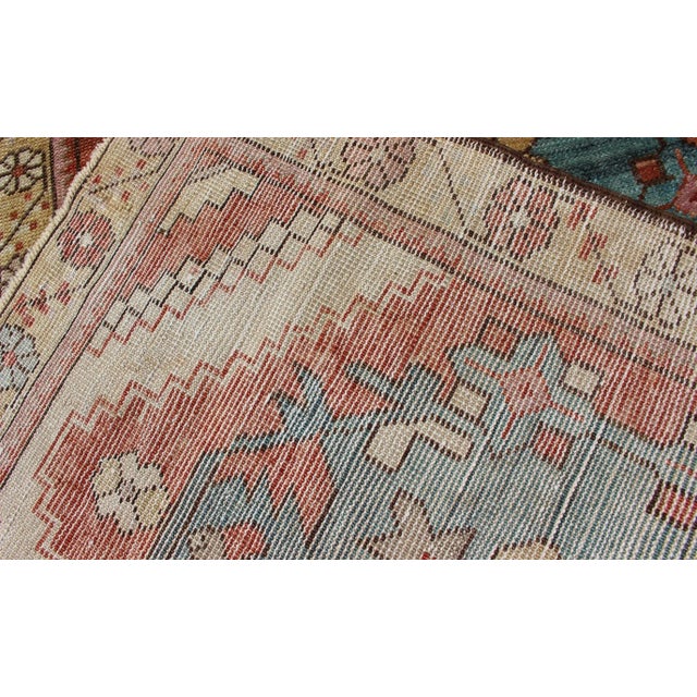Arts & Crafts Colorful Antique Oushak Runner With Medallion Design in Terracotta, Yellow & Teal Blue For Sale - Image 3 of 9