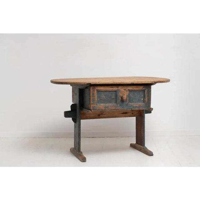 Folk Art country table from northern Sweden made in pine during the late 1700s. The charming table is an unusual country...