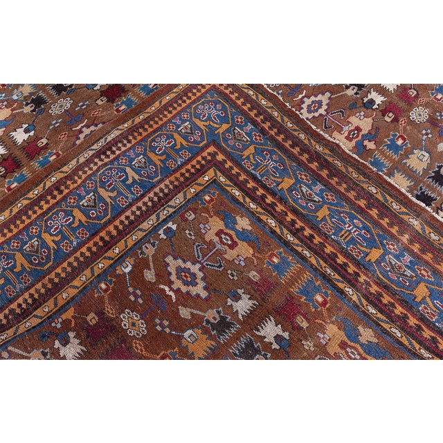 An unusual early 20th century antique dianthus Indian carpet, the walnut field with a straight tendril, and geometric...