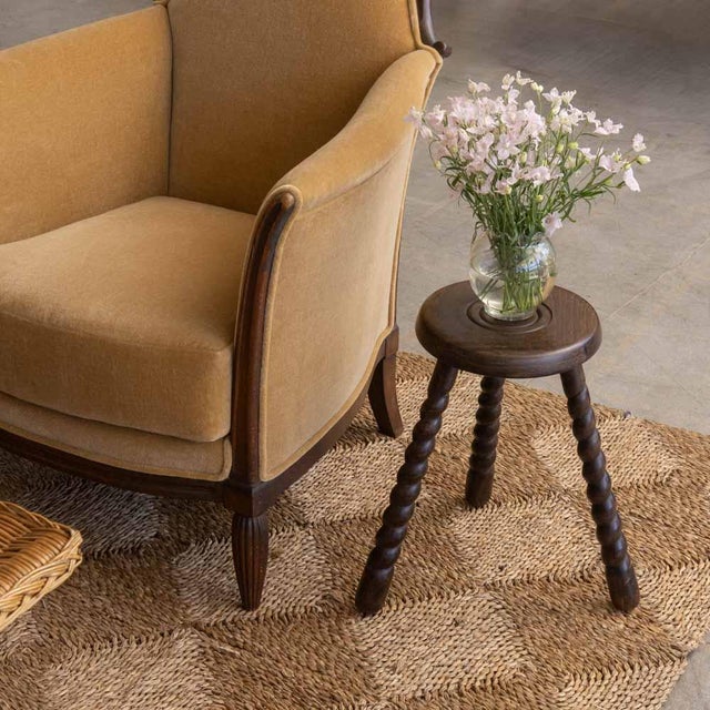 Unique vintage stool with circular seat and twisted tripod legs from France. Circular seat has beautiful carved ring...