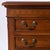 Small quality four drawer chest with dovetailed drawers. Detailed carvings above drawers. Great for a bedroom side table...