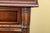 A carved walnut Tudor style sideboard cabinet of commanding presence and exceptional craft — 62.5"W x 21.5"D x 37.25"H,...
