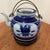 This antique Chinese export blue and white porcelain teapot with a wire bail handles hails from the Qing Dynasty era....