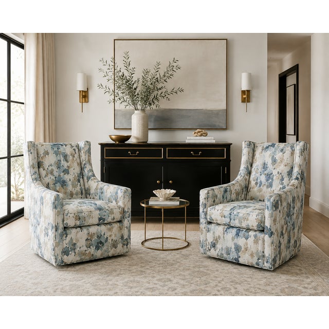 A handsome pair of Ethan Allen custom swivel rocker lounge chairs, expertly upholstered in a sophisticated watercolor-...