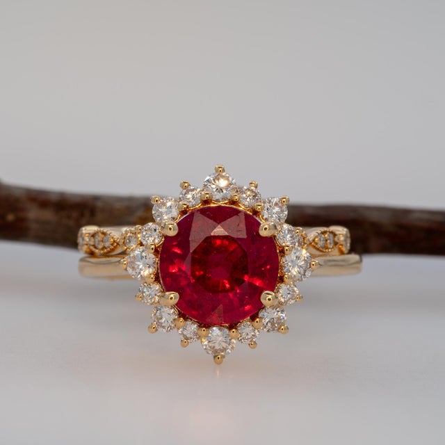 A line of earth-mined diamonds traces this open, adjustable band in solid 14K yellow gold. Designed to stack or stand...