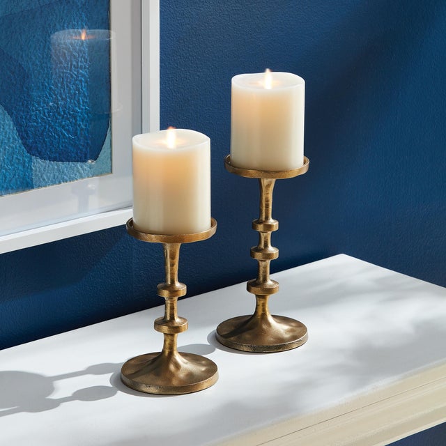 In a playful nod to the old way of counting, the notches along the body of these candle stands add a modern touch. This...