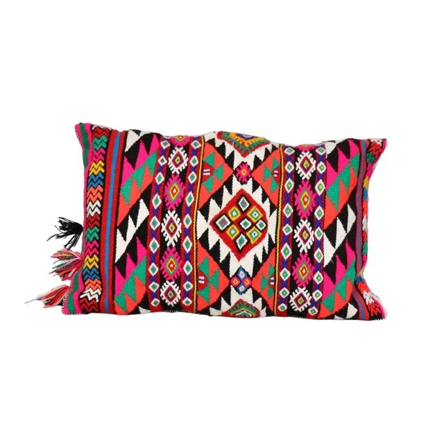 This vibrant pillow crafted from a repurposed Moroccan old rug, embodies the spirit of traditional Moroccan décor. Its...