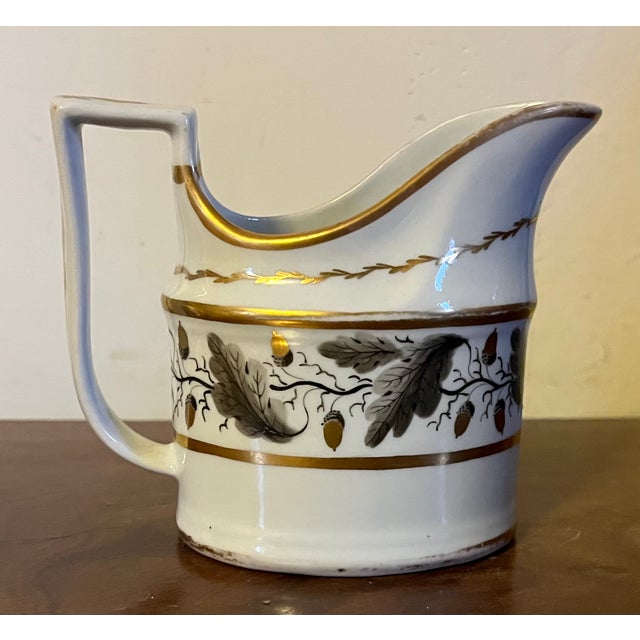 Antique 18th century Worcester porcelain cream jug decorated with oak leaf garland and acorns enhanced by gilding....