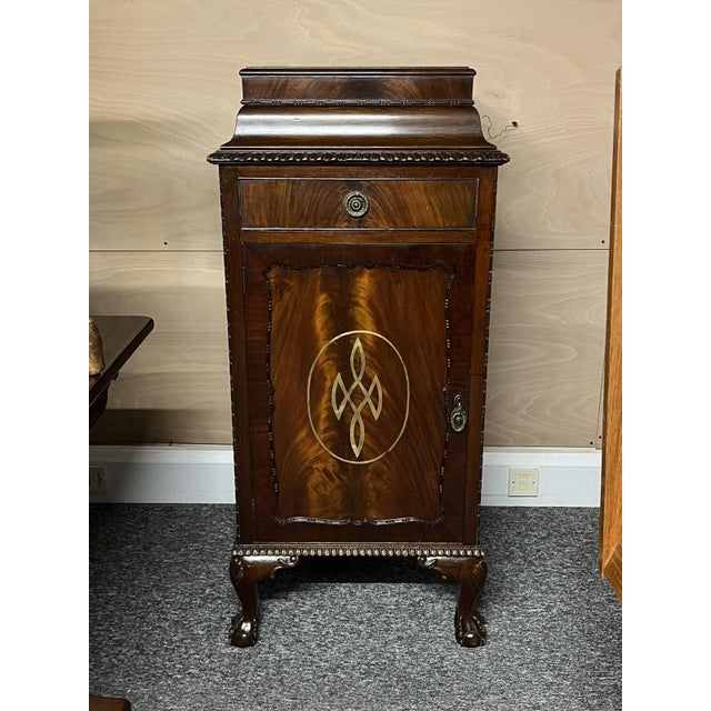 Edwardian Mahogany Wine Celleratte Cabinet with Scottish Crest painted on front in gold leaf. Made of mahogany, standing...
