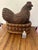 Eye catching monumental rare carved wood hen resting in a nest. Makes an incredible centerpiece or sculptural accessory...