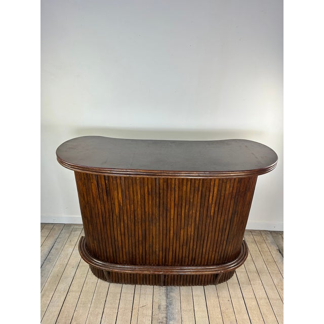 Vintage bamboo and rattan bar, dating from the 1970s, with a design emblematic of tropical interiors and the "Palm Beach"...