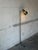 This adjustable metal floor lamp delivers sleek task lighting with a single directional spotlight shade. Built with a...