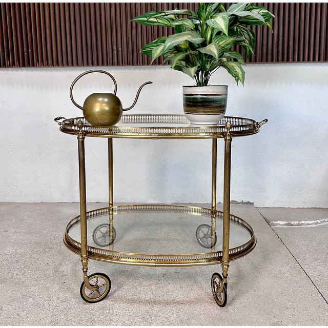 This Italian neo-classical bar and serving trolley was manufactured during the 1950s. The elegant piece shows an authentic...