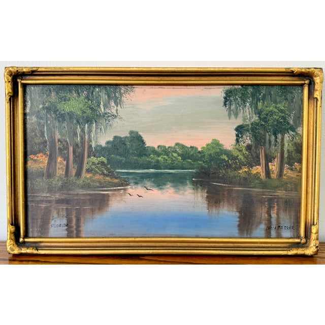 Midcentury Florida marsh at dusk oil painting, by Della Parker. Beautifully framed in gold gilt. Please see dimensions and...
