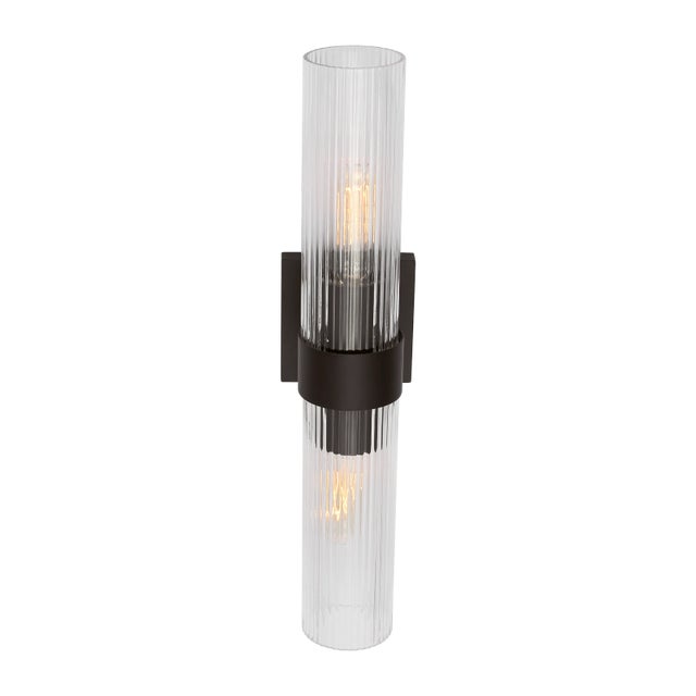 Slender fluted shades form an elegant, dynamic silhouette balanced by a strong frame of Aged Iron, Burnished Brass or...