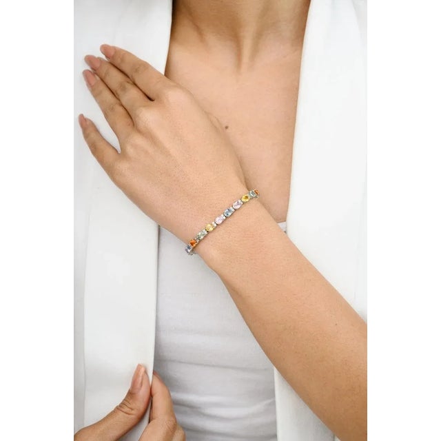 This is part of Chairish’s Fine Jewelry assortment. This Unique 13.03 CTW Multi Sapphire and Diamond Bracelet in 18K gold...