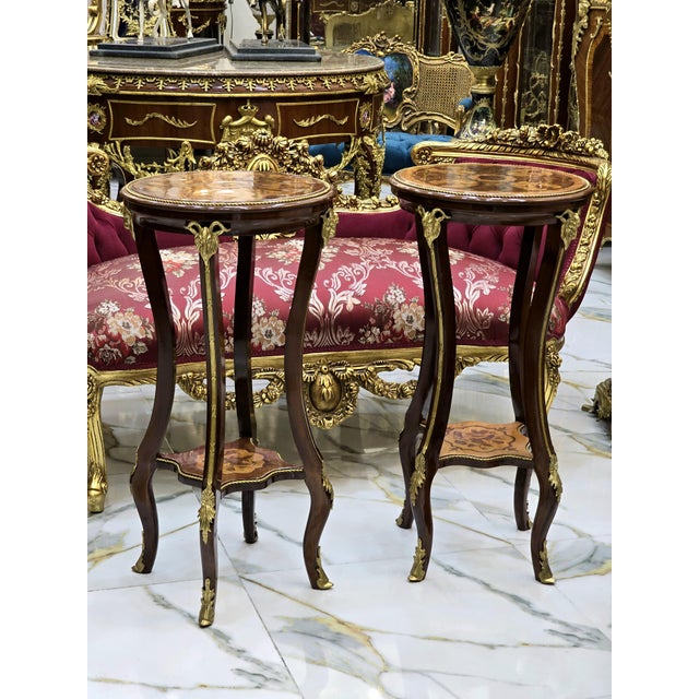 This French Baroque style wood side table set is a luxurious statement piece that brings timeless elegance and refined...