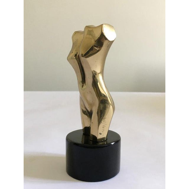 This engaging bronze sculpture on black wooden base, well represents a human bust, but for its expressive force, the bust...