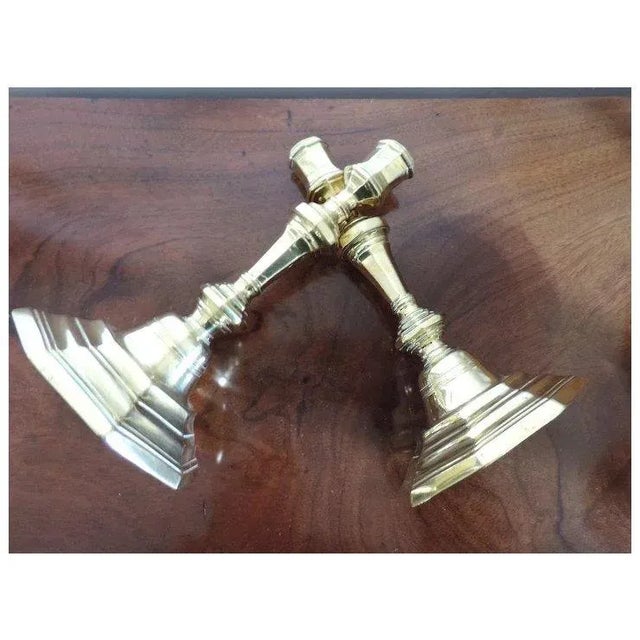 A fine pair of polished brass candlesticks from France and dating to the 18th c. Octagonal stepped bases and nicely shaped...