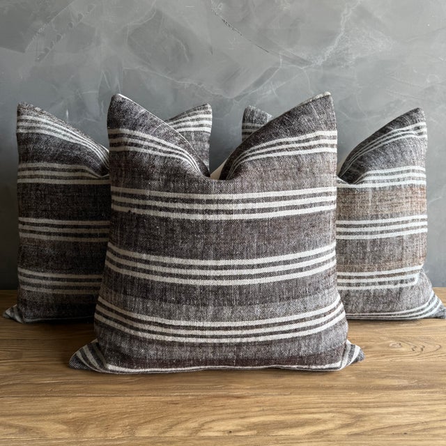 Creamy white hemp rug pillow with stripes. Soft hand, linen blend backing with zipper closure. Spot cleaning is...