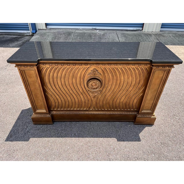 Dimensions: 68” Length x 22” Depth x 38” Height Features a solid stone top – likely black granite with elegant white...
