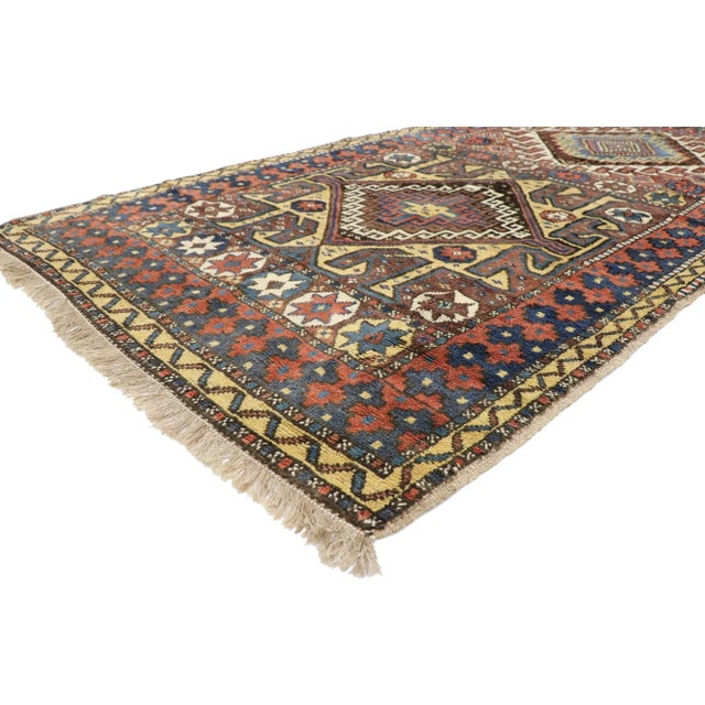 Antique Azerbaijan Rug with Tribal Style 05'00 x 09'03. With its geometric pattern, bold form and earth-tone colors, this...