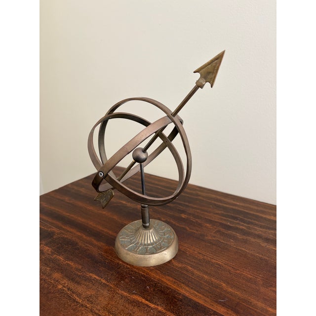 A stunning vintage English country or Neoclassical style gold iron garden armillary sundial with Roman numerals USA, Late...