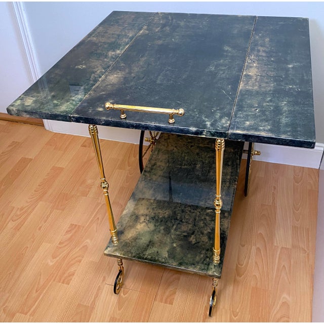 Aldo Tura Green Lacquered Goatskin Bar Cart, Brass Two-Tier Folding Drinks Trolley, Italy 1960s A refined and highly...