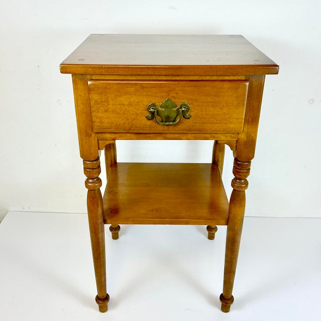 This Side Table is part of the Ethan Allen American Traditional Collection in Heirloom Maple with their signature Nutmeg...