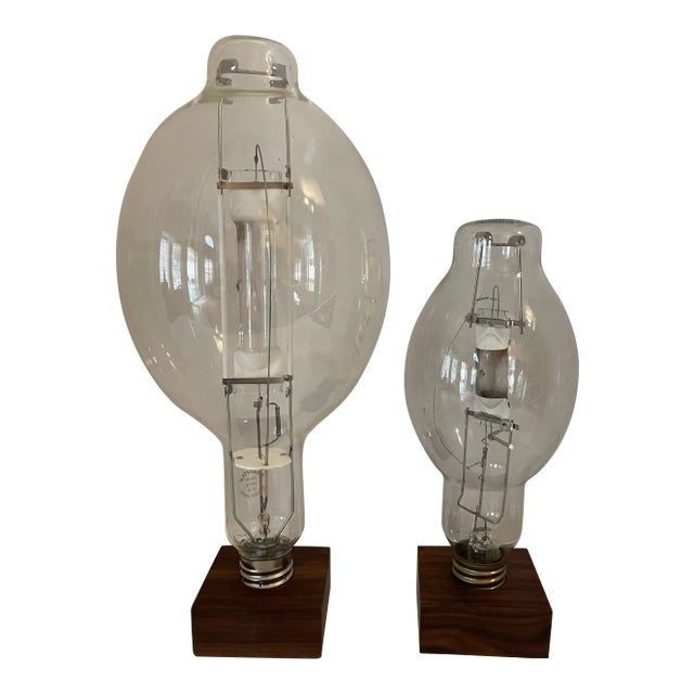 Vintage Retro High Pressure Sodium Industrial Bulb Display on Wood Pedestal Marked "Roost" - Set of 2 For Sale