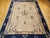 This elegant late 19th century Chinese Peking rug features a soft pale yellow field of great serenity, beautifully framed...