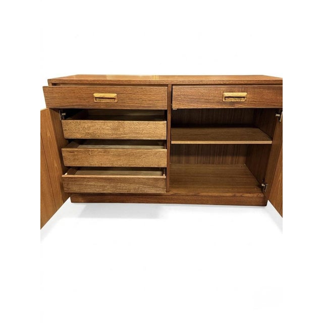 A quality mid century sideboard by dixie furniture, usa, stamped internally, and finished in a warm teak tone. Clean-lined...