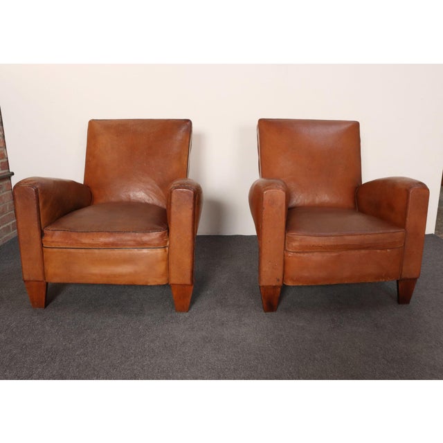 Handsome pair of late 1930s/early 1940s French club chairs sourced in the south of France in supple sheep hide leather...