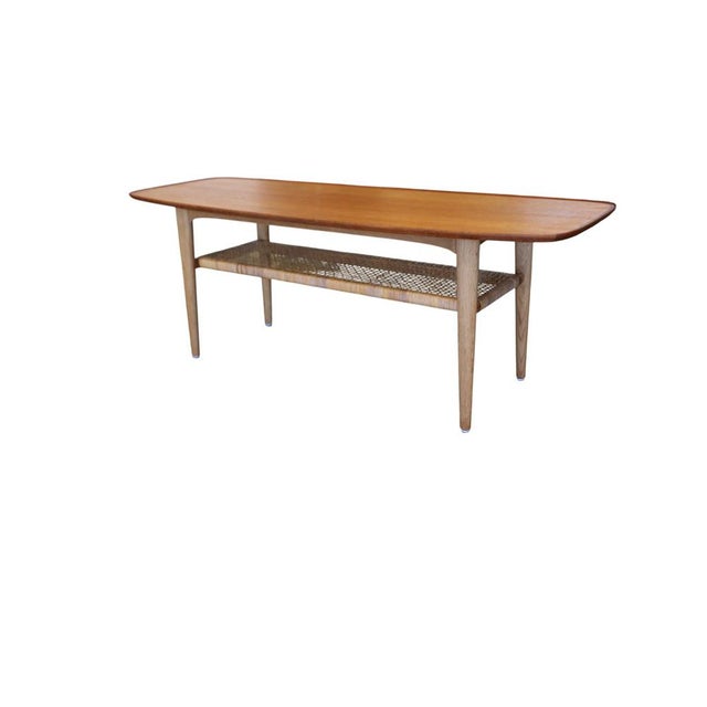 A neat and elegant Danish coffee table, attributed to Børge Mogensen for Fredericia Stolefabrik. The table has a light and...