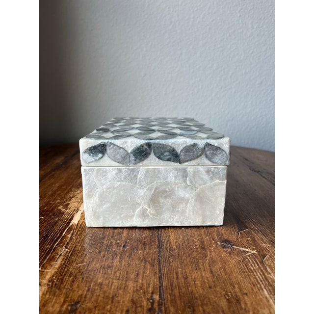 Capiz Shell Box with cover Made in the Philippines 8" width, 5" depth and 3 3/8" height May have imperfections.