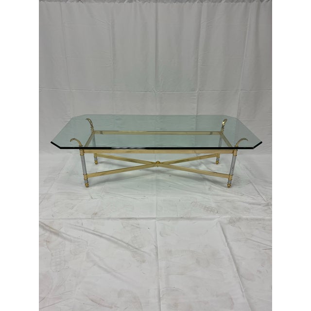 Sophisticated French coffee or cocktail table with a stunning brass and chrome frame with beautiful graphical design and...