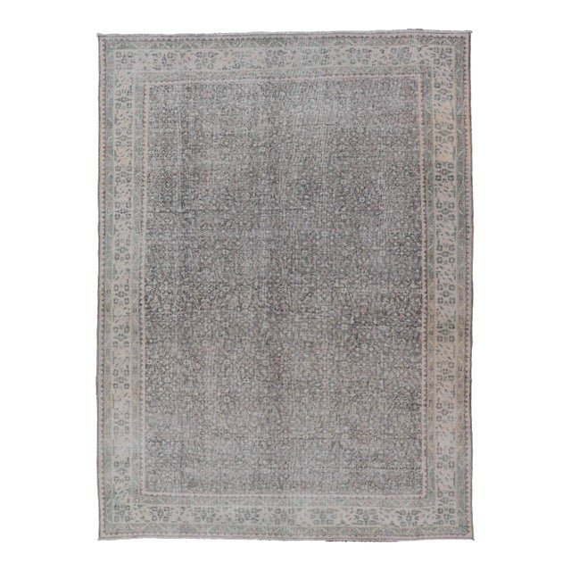 Mid 20th Century Vintage Hand-Knotted Distressed Turkish Rug in Wool With All-Over Floral Pattern For Sale